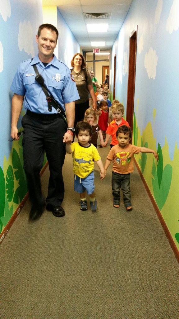 Firefighter Aaron with the Madison Fire Dept. walking our friend Aaron and his Peacock buddies back to the classroom after a practice fire drill. 